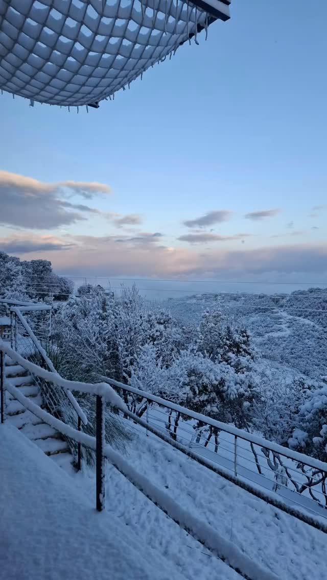 The terrace and hills under winter snow